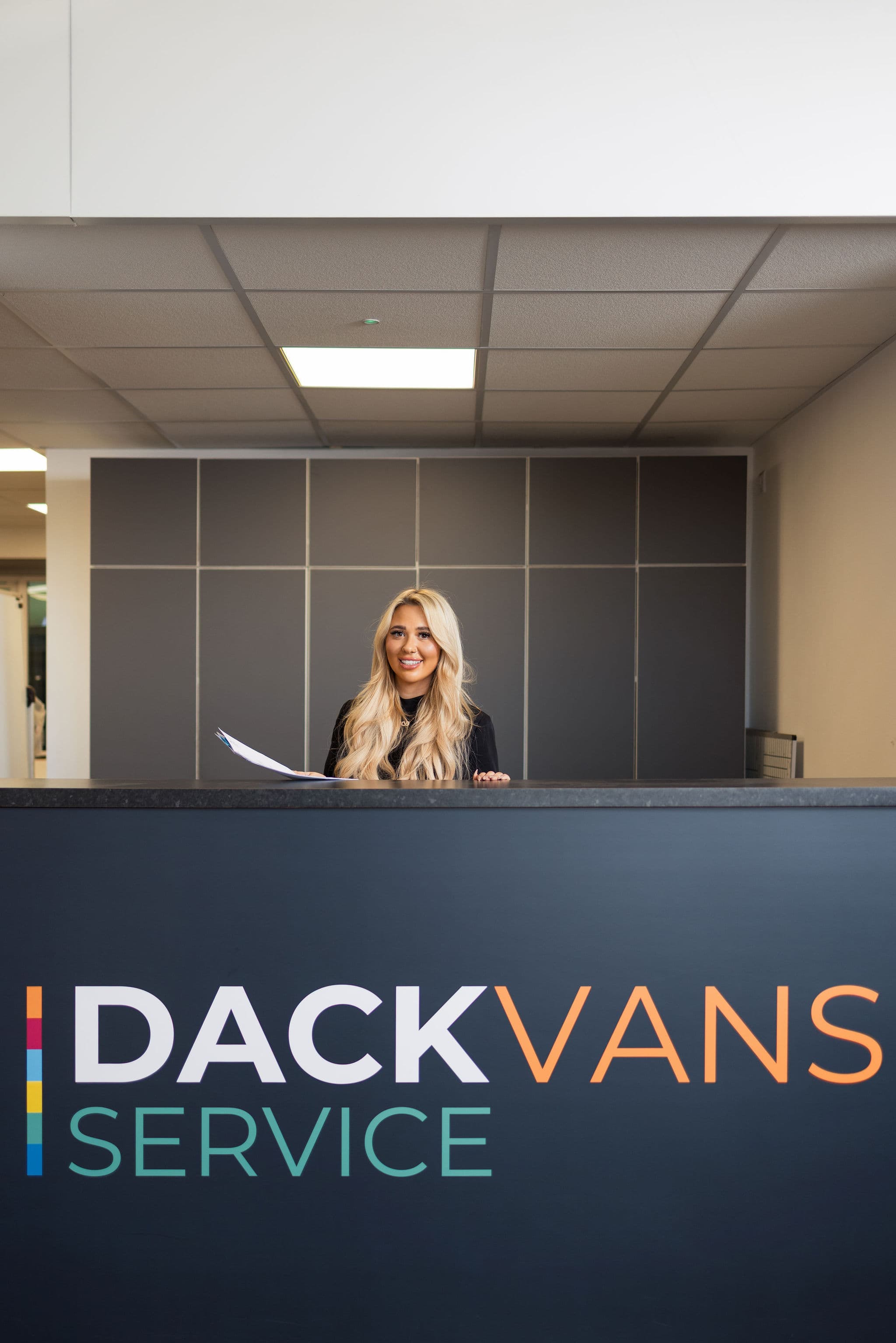 A Dack Vans Service advisor ready to take a booking at the service reception desk